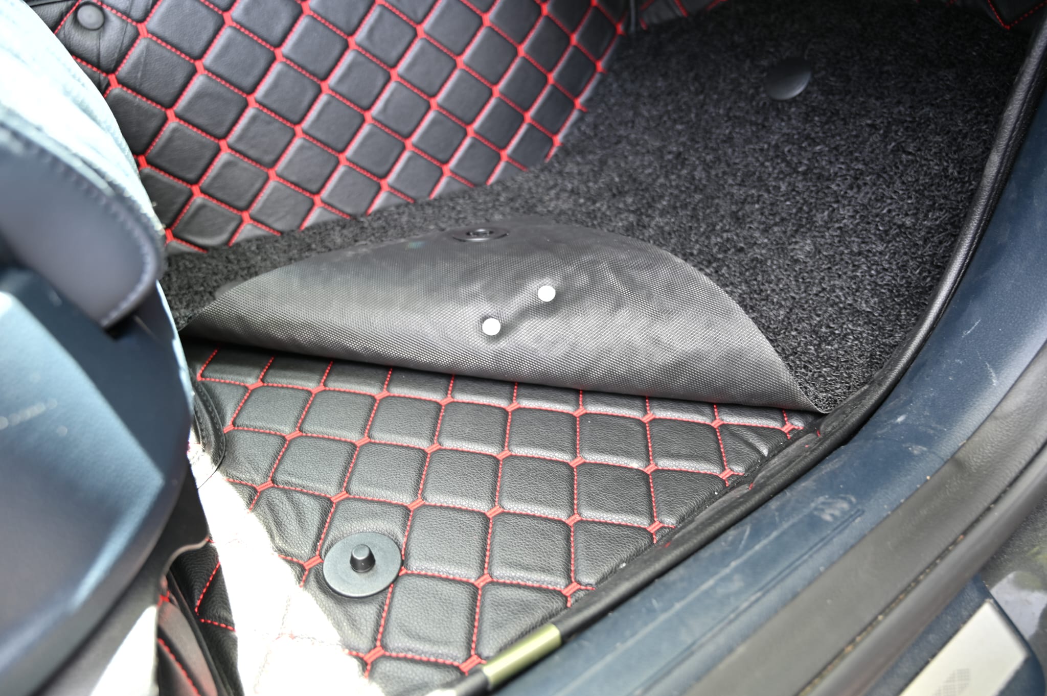Mat Metrics car mats installed on a Genesis GV70; product: Cubic Series Black/Red Stitching with Black Detachable Vinyl Insert