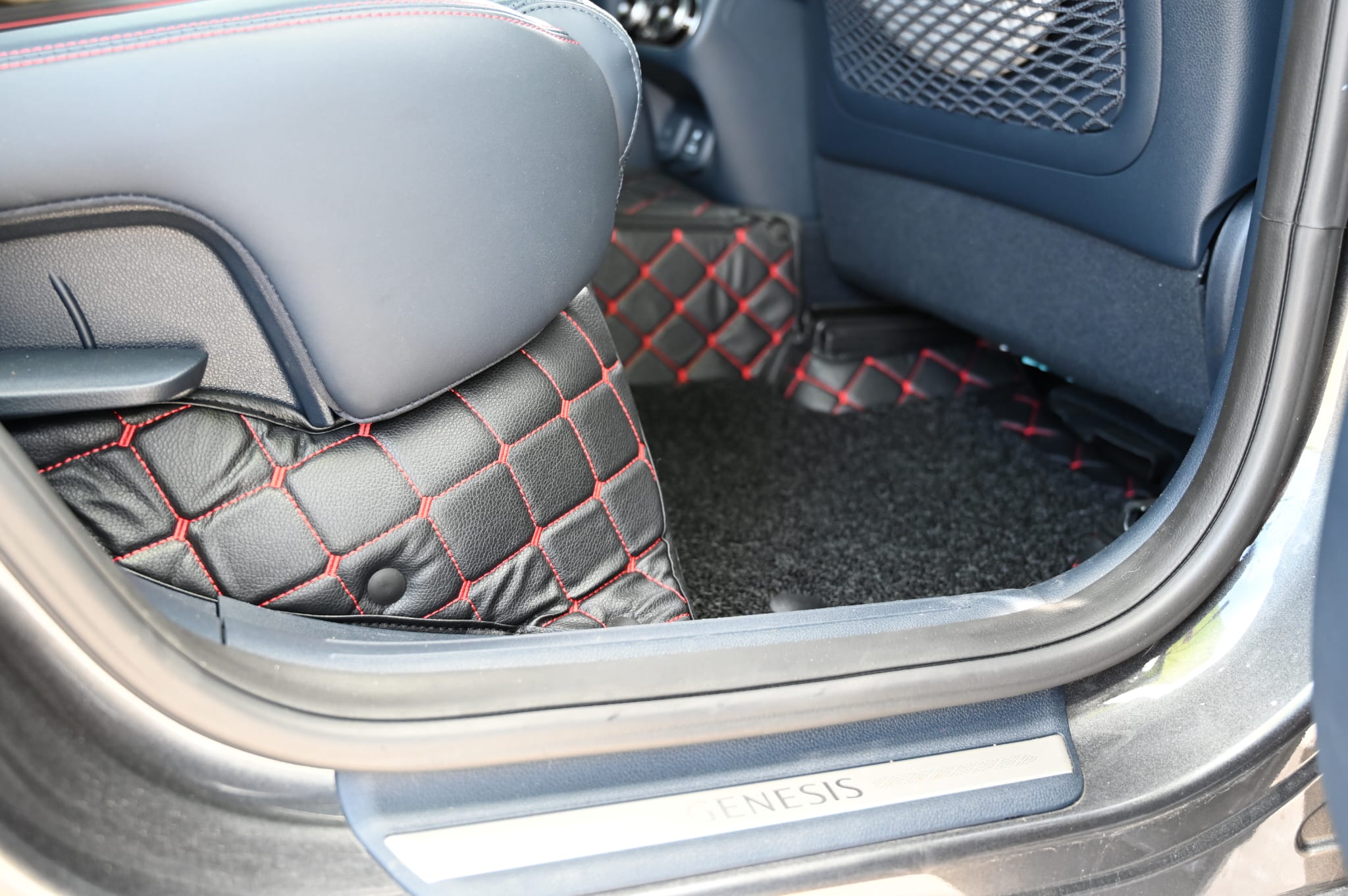 Mat Metrics car mats installed on a Genesis GV70; product: Cubic Series Black/Red Stitching with Black Detachable Vinyl Insert