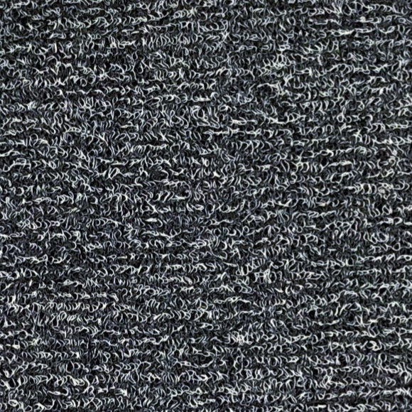 Close-up of the detachable vinyl carpet material, grey colour